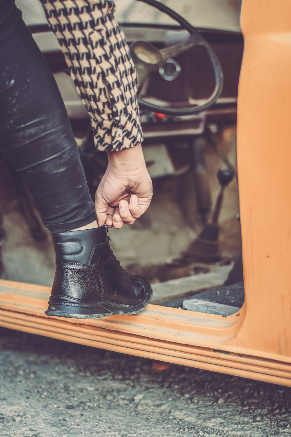 a person wearing black boots