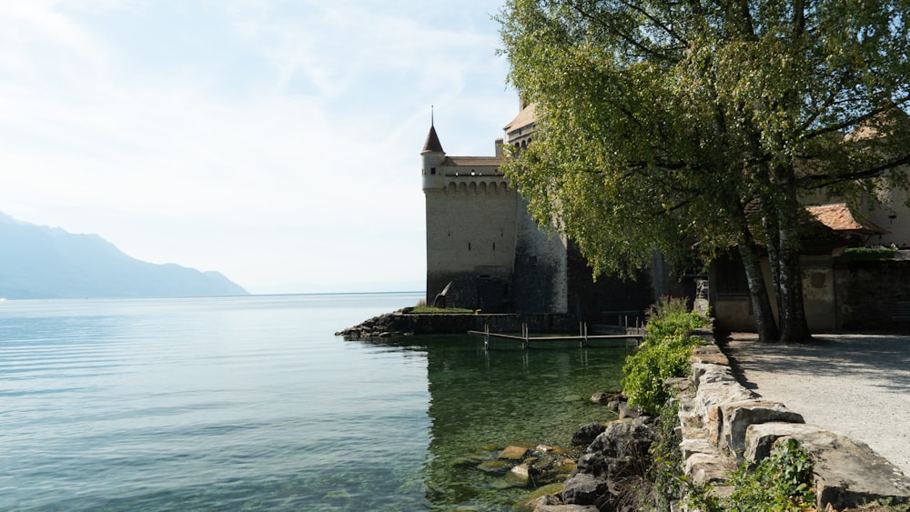 a building next to a body of water