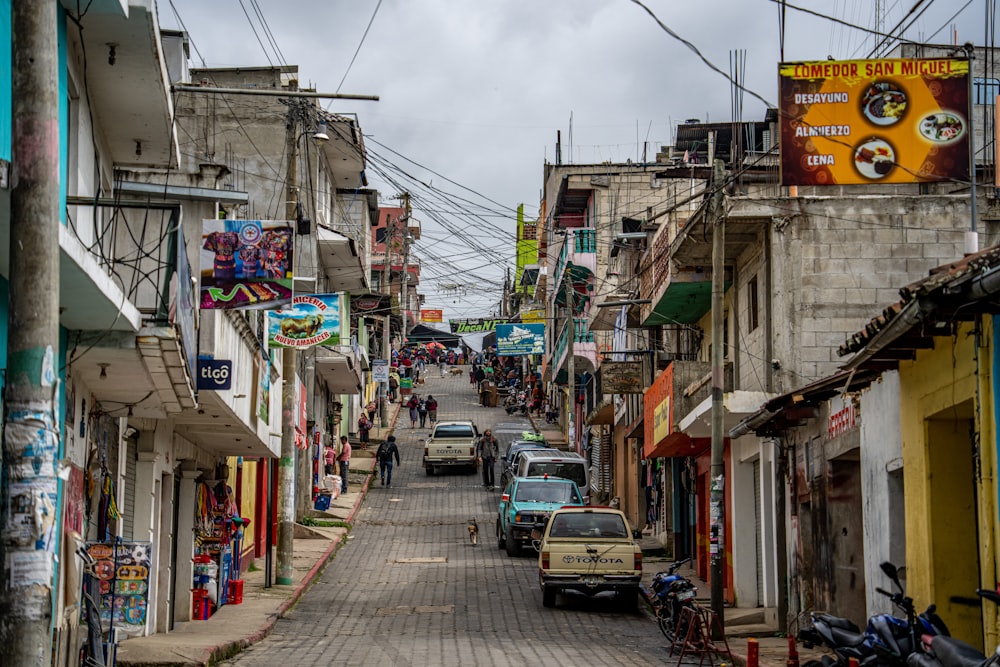 a street with cars and people