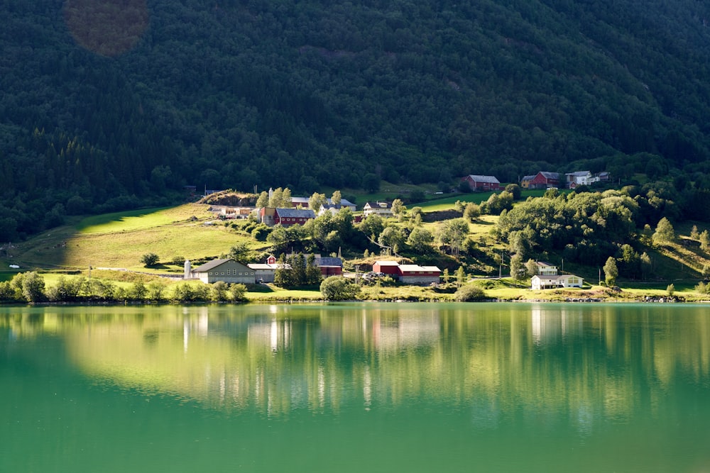 a lake with a small town in the distance