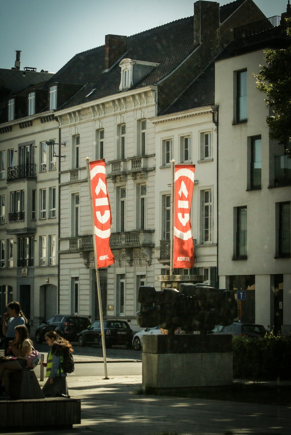 a group of people sitting outside a building