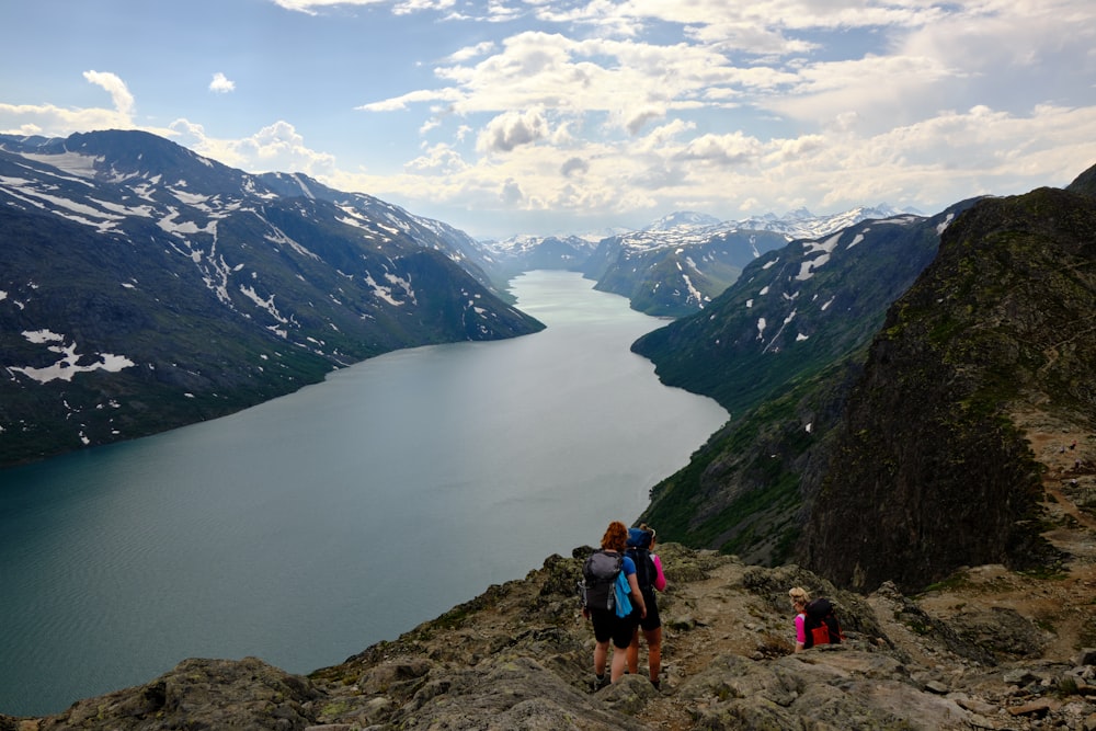 a group of people hiking on a mountain top