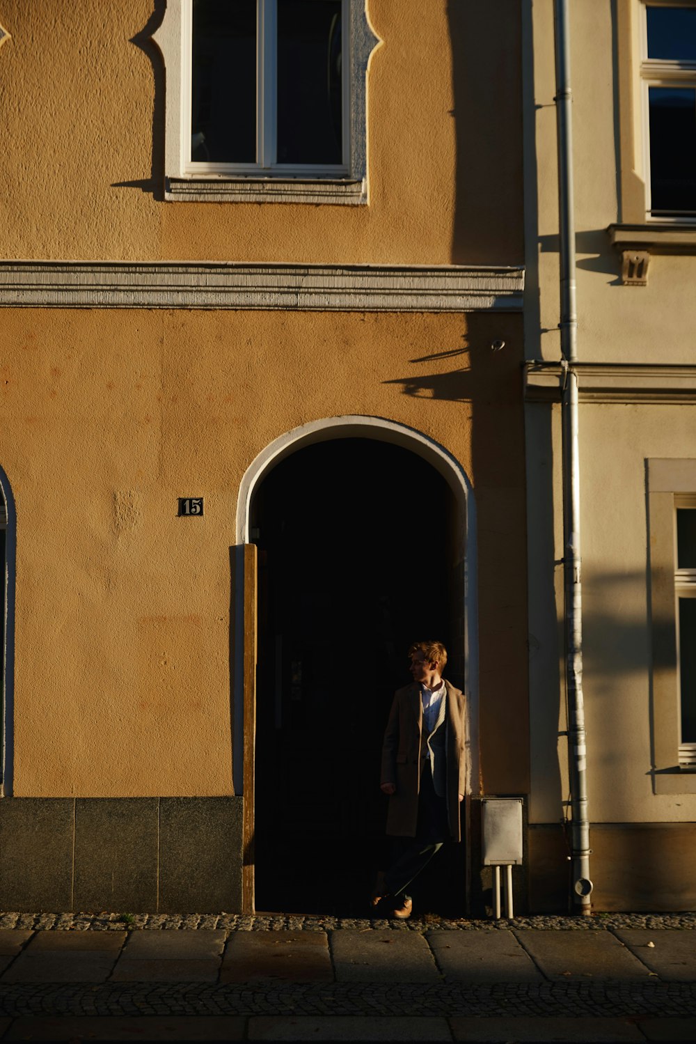 a person standing in front of a building