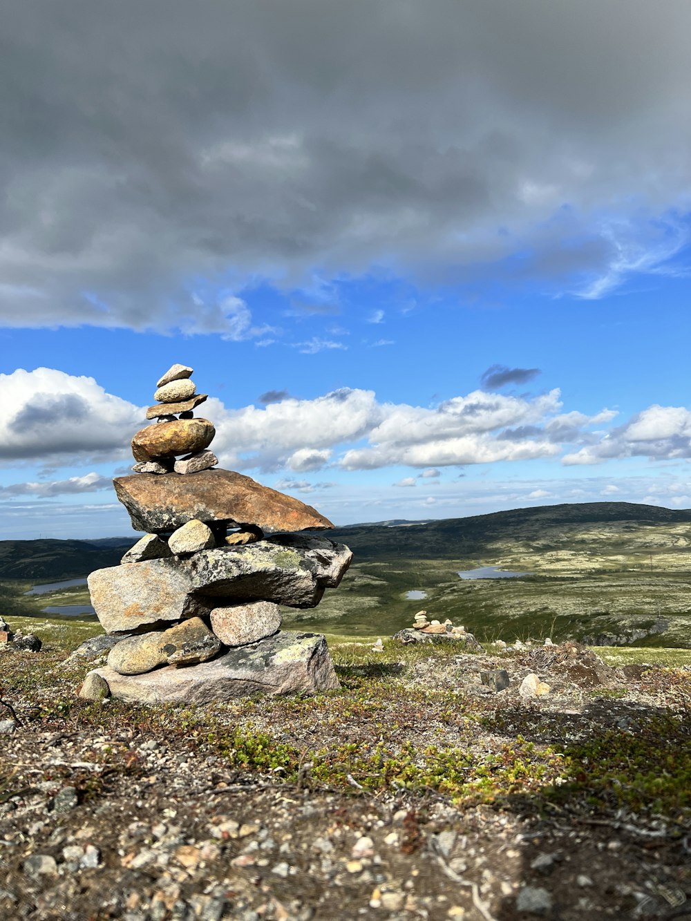 a stack of rocks on a rocky hill