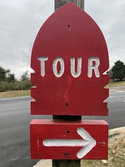 a stop sign with a white arrow
