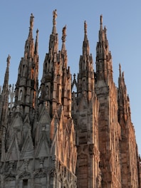 a large stone building with Sagrada Família in the background