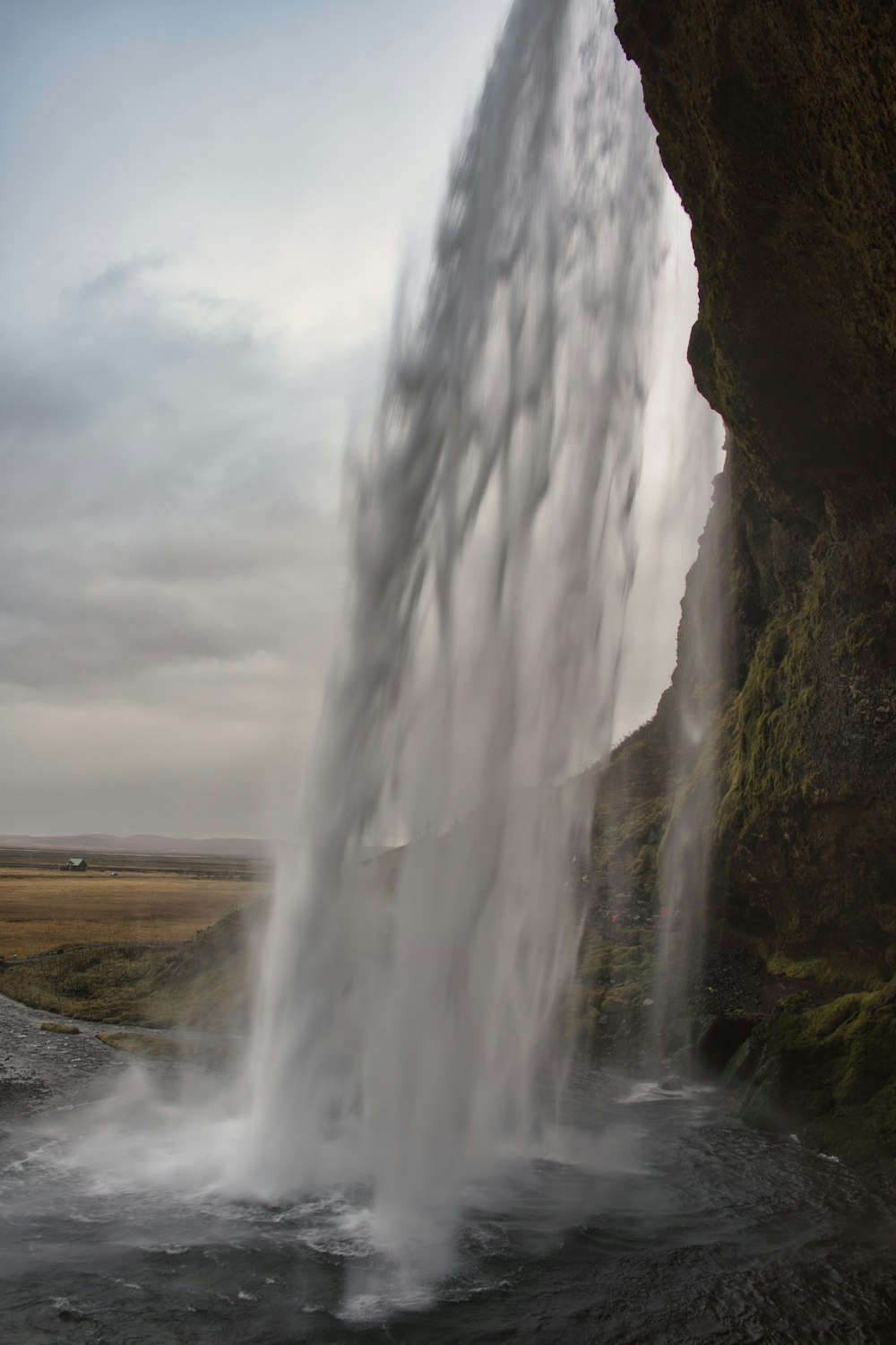 a waterfall with a rainbow