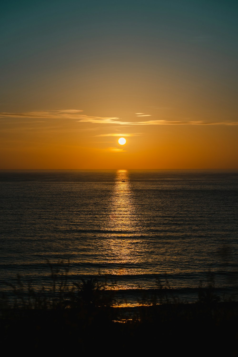 a sunset over a body of water