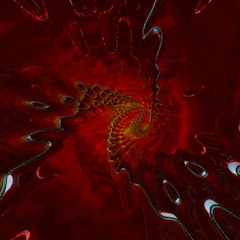 A swirling pattern of abstract fractal art with a focus on intense red tones. The image creates a vortex-like effect with intricate details and a liquid-like texture, exhibiting a hypnotic and dynamic flow toward the center.