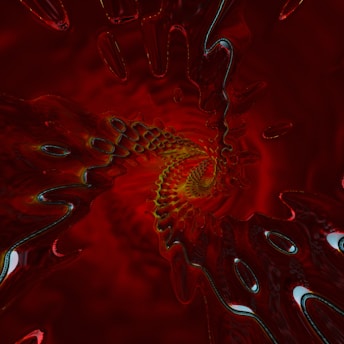 A swirling pattern of abstract fractal art with a focus on intense red tones. The image creates a vortex-like effect with intricate details and a liquid-like texture, exhibiting a hypnotic and dynamic flow toward the center.