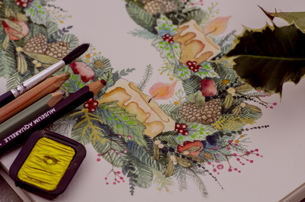 a table with books and a bouquet of flowers