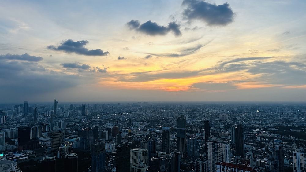 a cityscape with a sunset