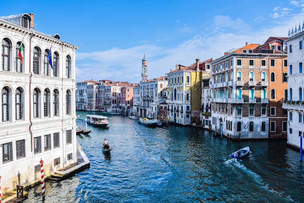 a canal with boats in it and buildings around it