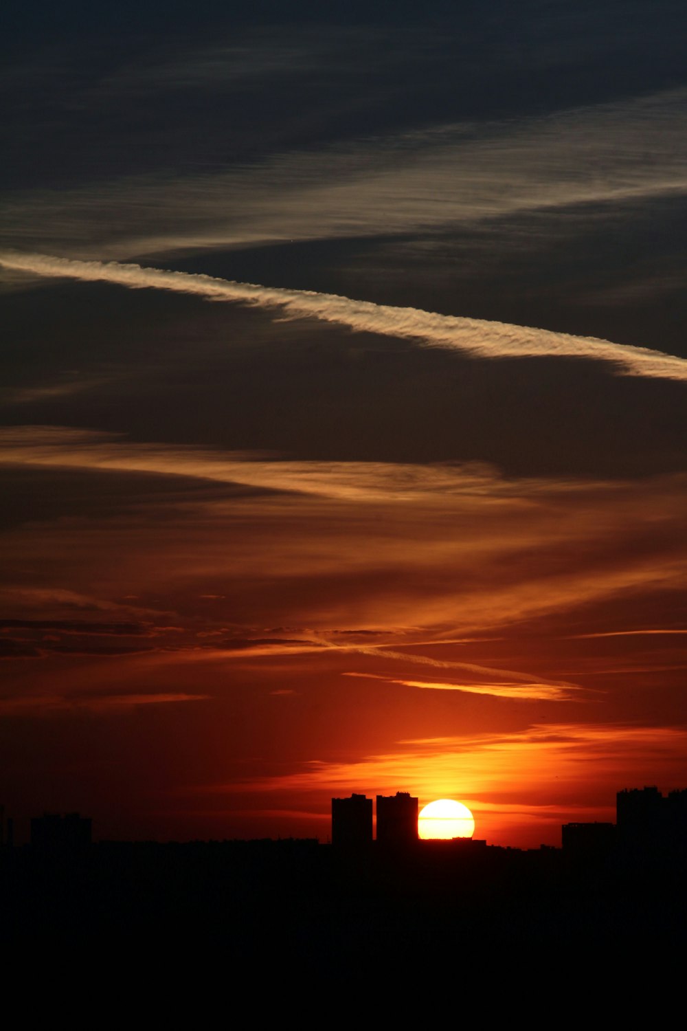 a sunset over a city