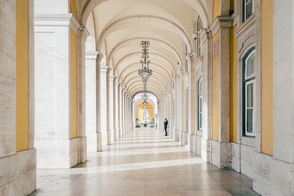 a person walking down a hall way