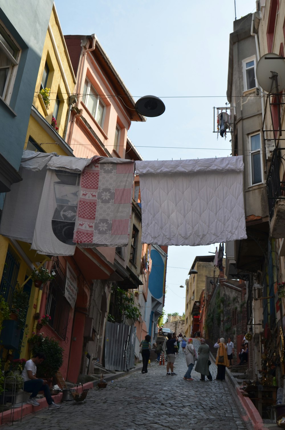 people walking in a narrow street