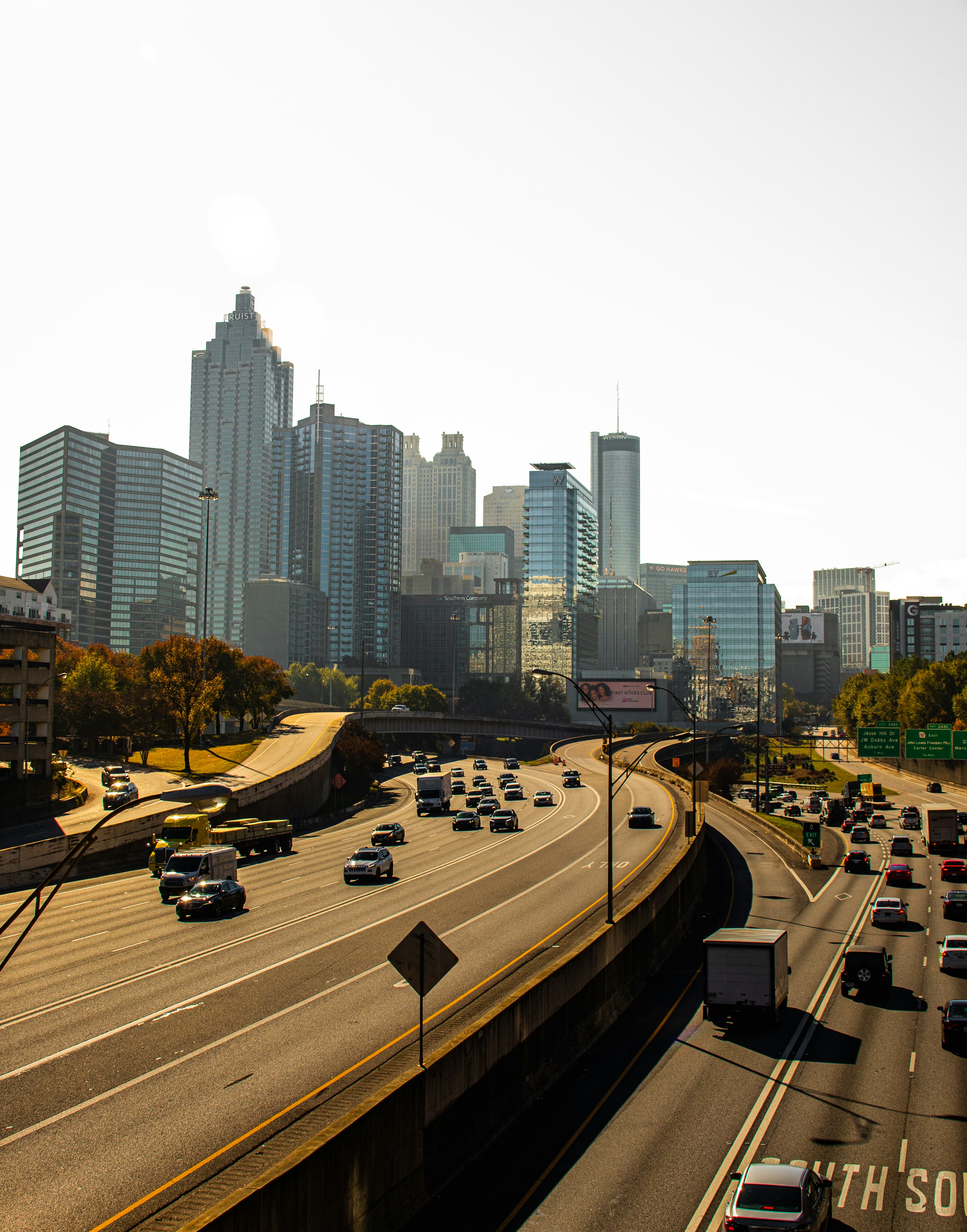 a city street with cars and buildings