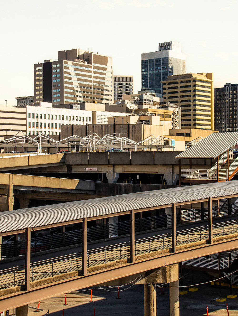 a bridge over a river with buildings in the background