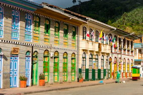 a building with flags on the roof