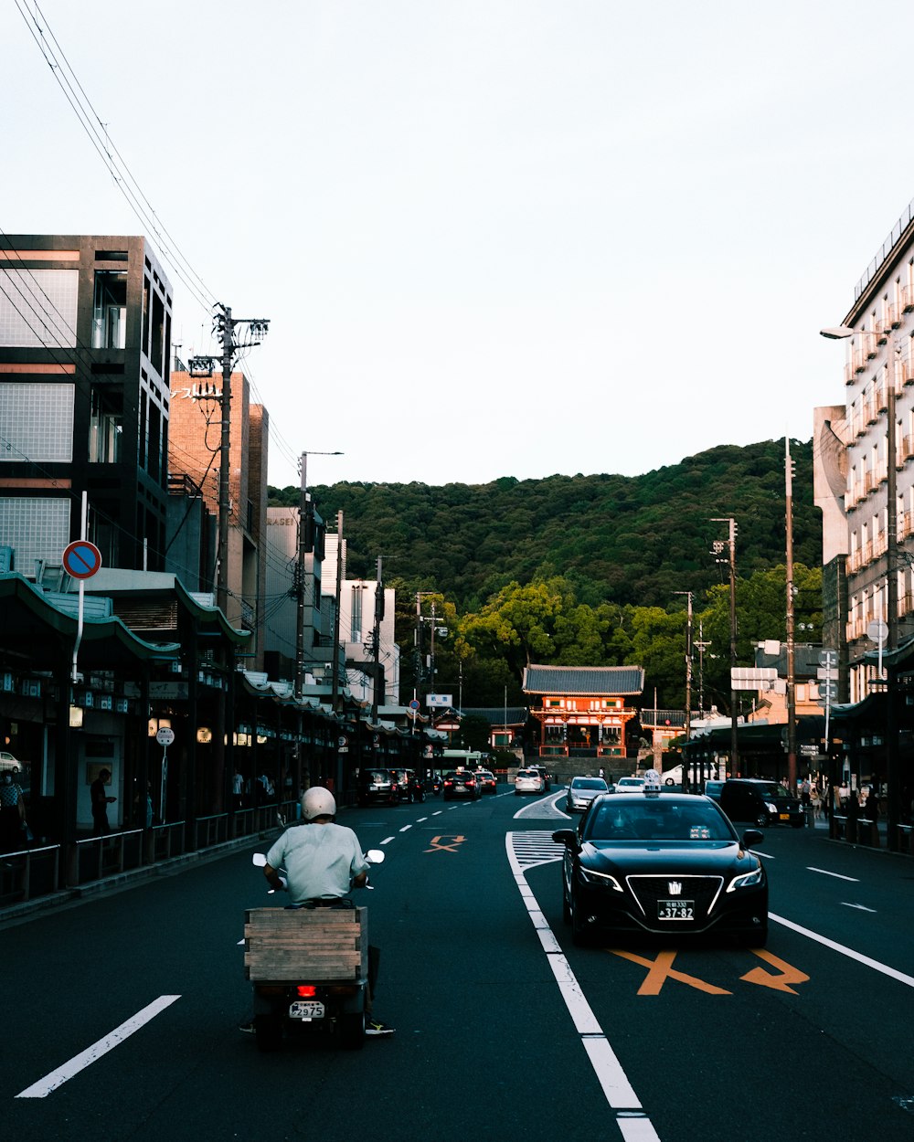 a person riding a motorcycle down a street