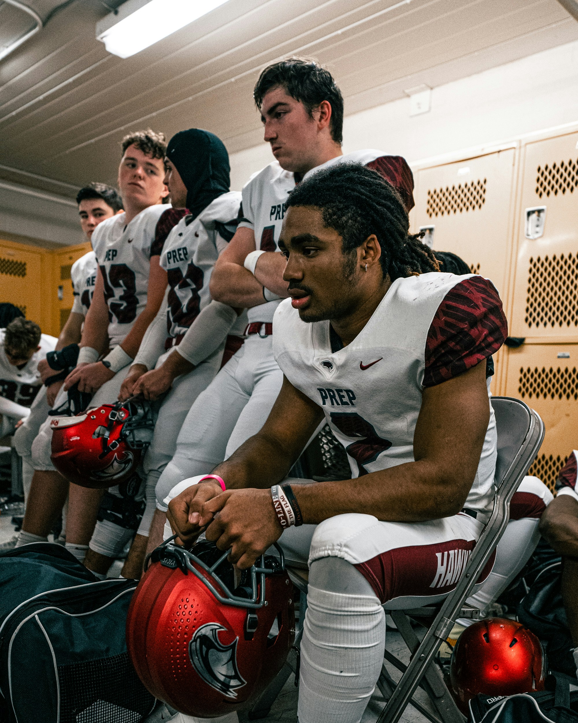 a person in a wheelchair with another man in a gym
