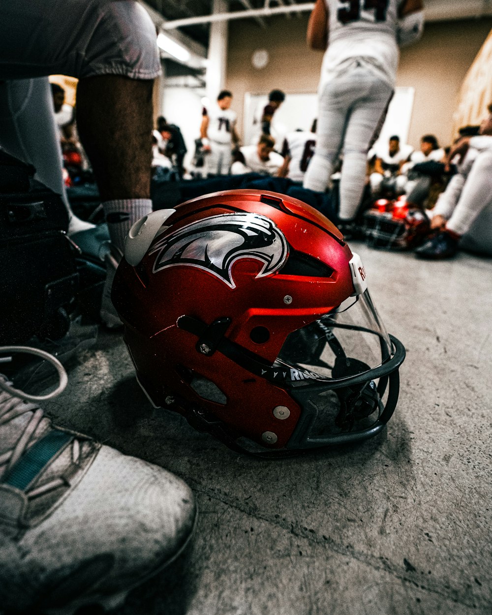 a red helmet on a person's leg