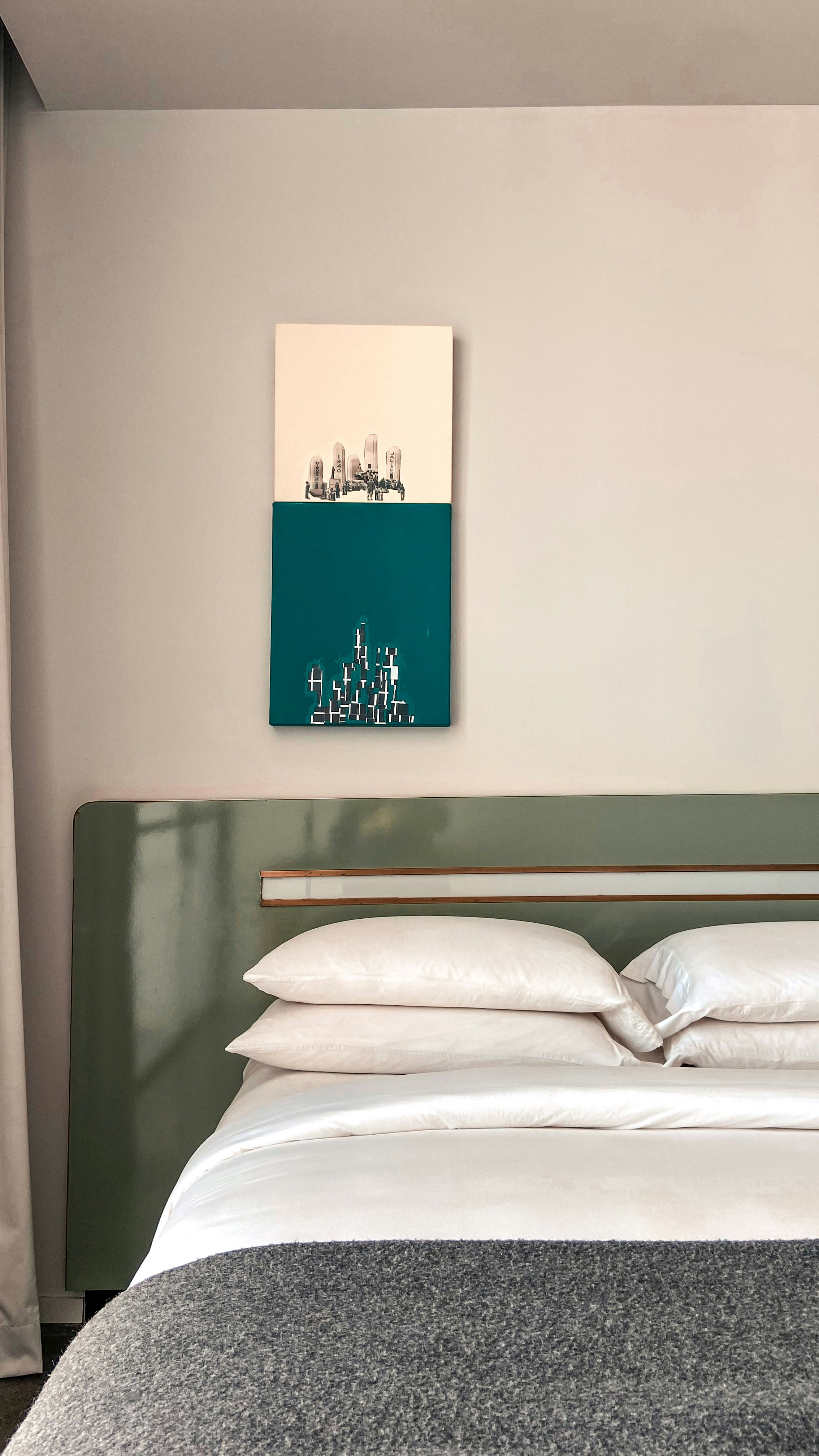 a bed with a sign on the wall