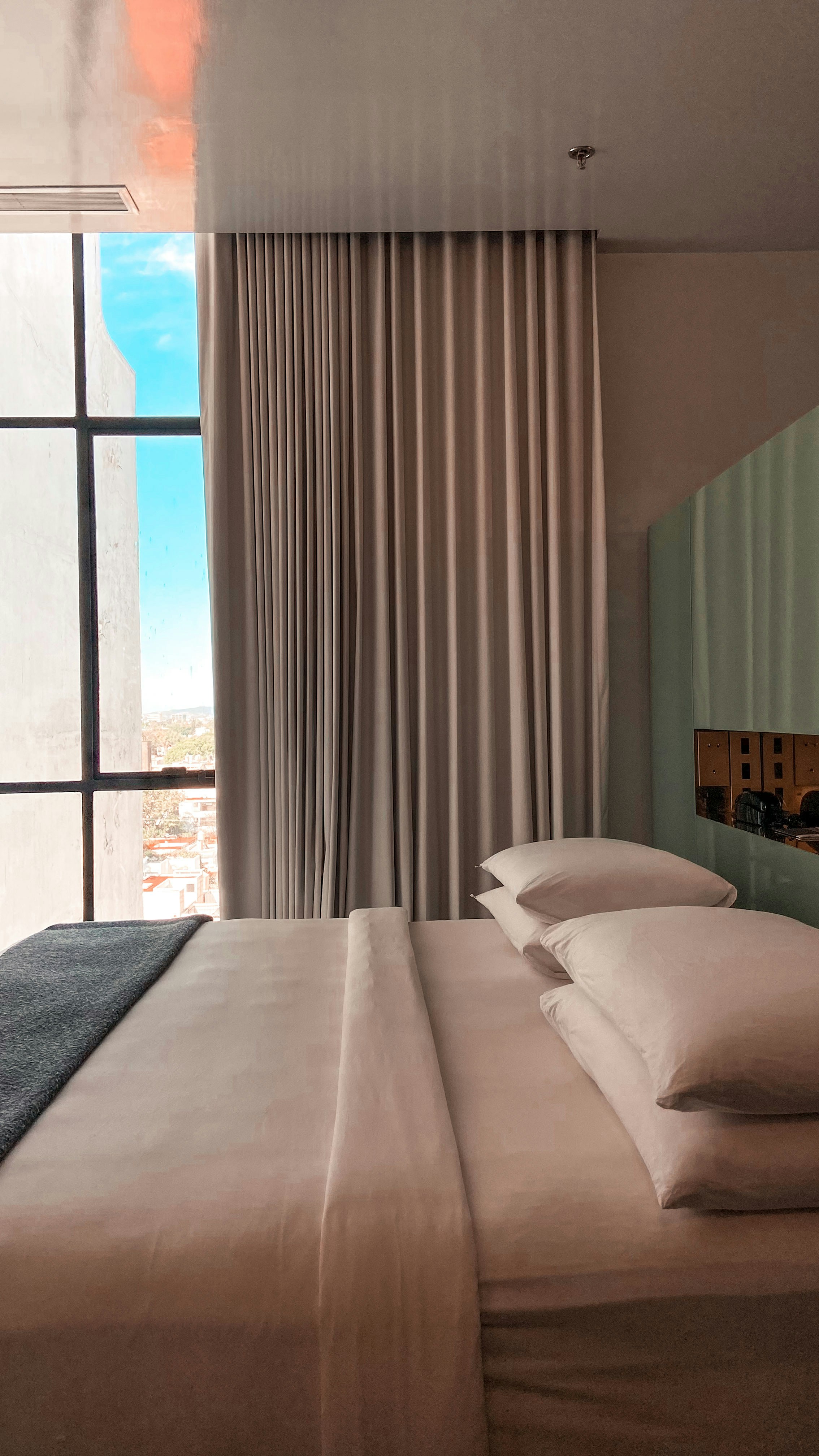 a bed with a white comforter