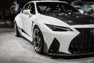 a white car parked in a showroom