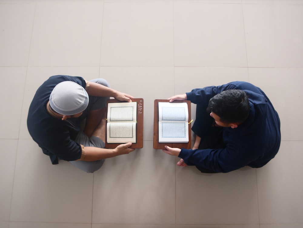 a man and a woman in a room with white walls