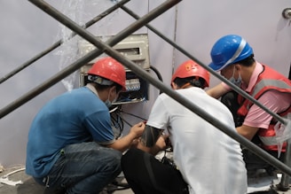 a group of people wearing hard hats