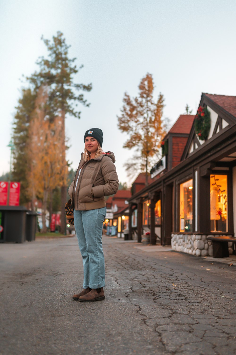 a man standing on a cobblestone street