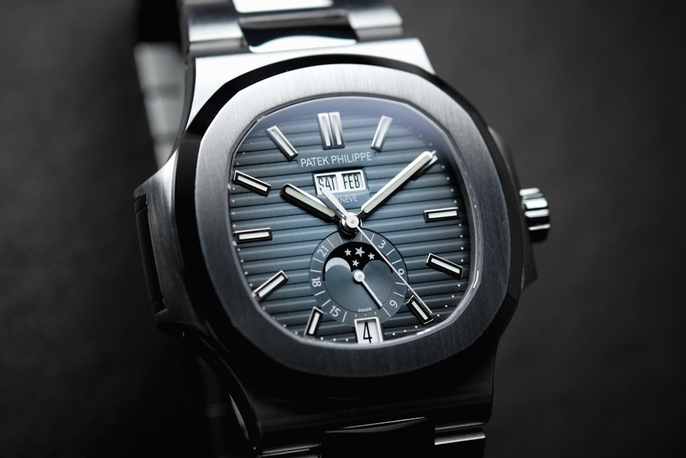 a black watch with a silver face