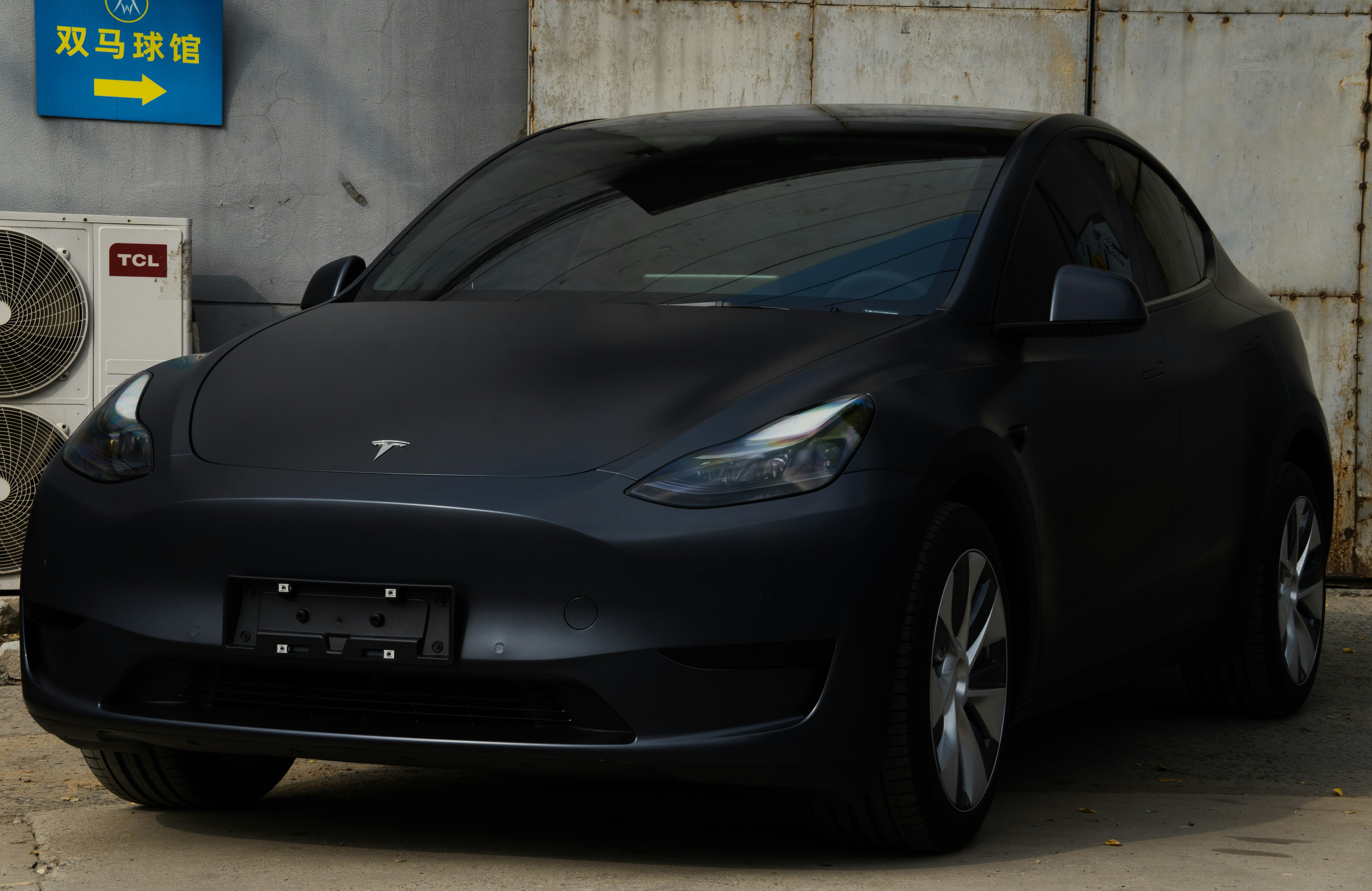 a black car parked in a garage