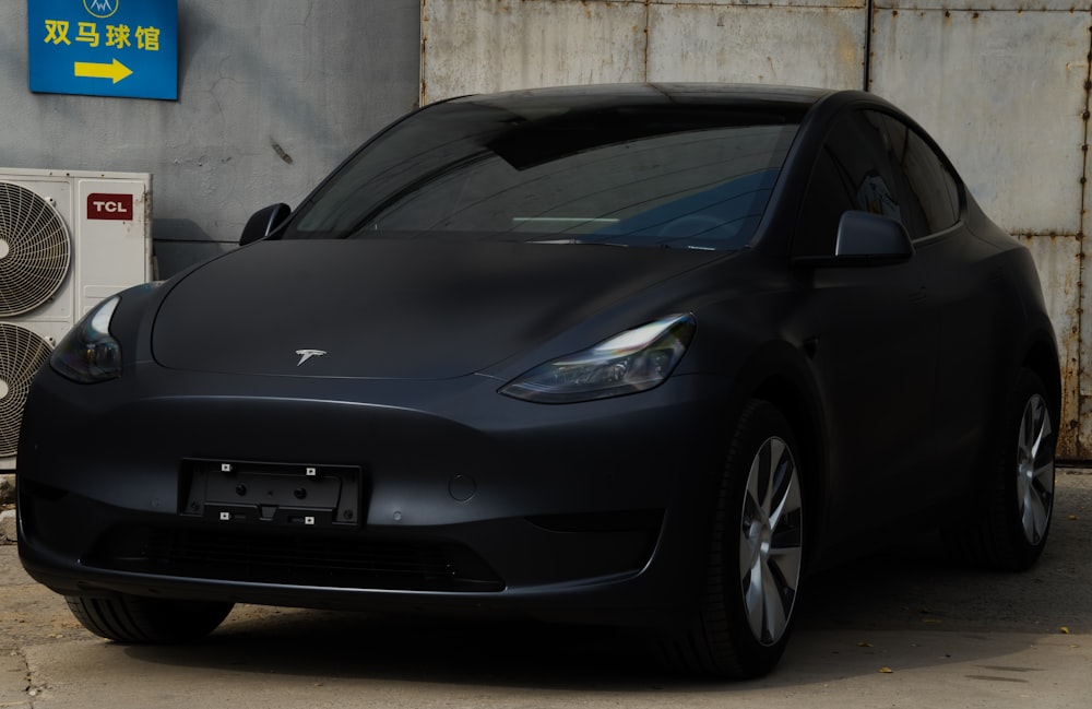 a black car parked in a garage