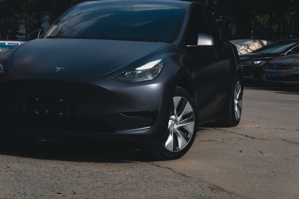 a black car parked on a street