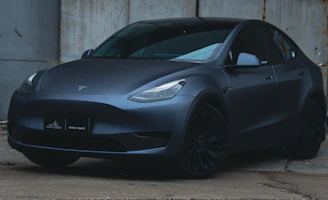 a black car parked in a garage