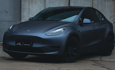 a black car parked in a garage