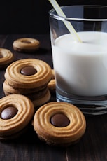 a group of pastries with a drink in the background