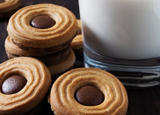 a group of pastries with a drink in the background