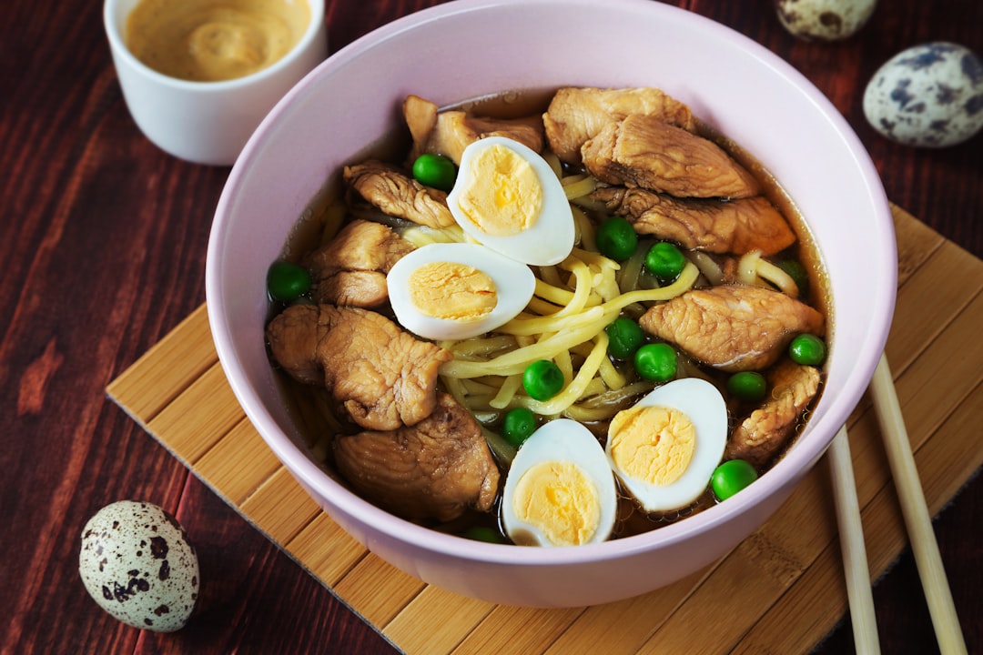 a plate of food, Ramen soup with noodles and quail eggs