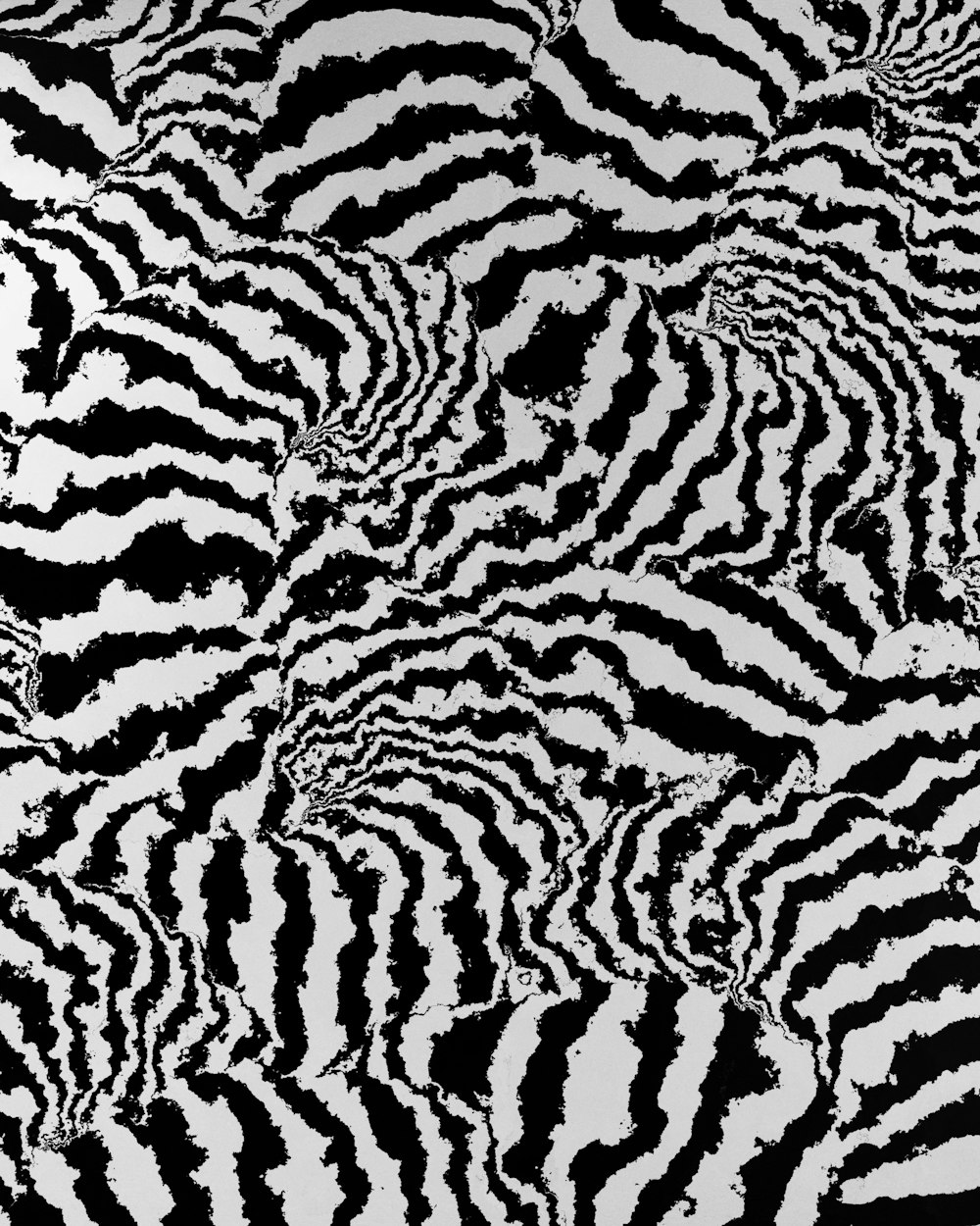 a black and white image of a black and white textured surface