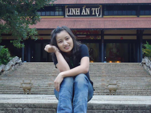 A traveler enjoying a peaceful moment at a historic Vietnamese temple.