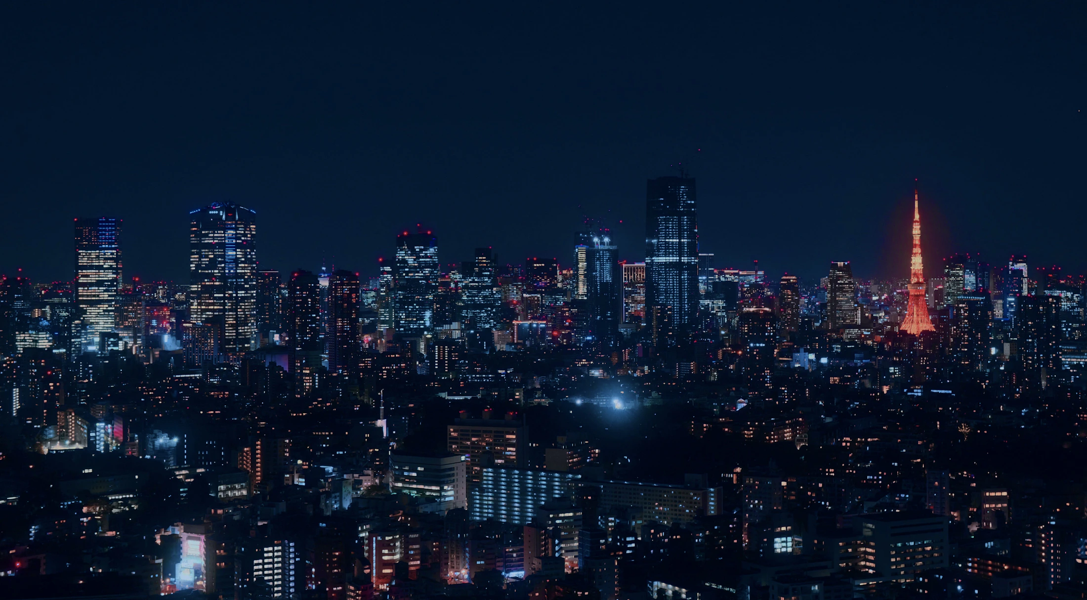 Tokyo Tower glowing above the Japanese capital at night