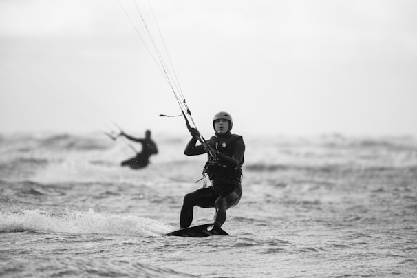 a man kite surfing in the sea