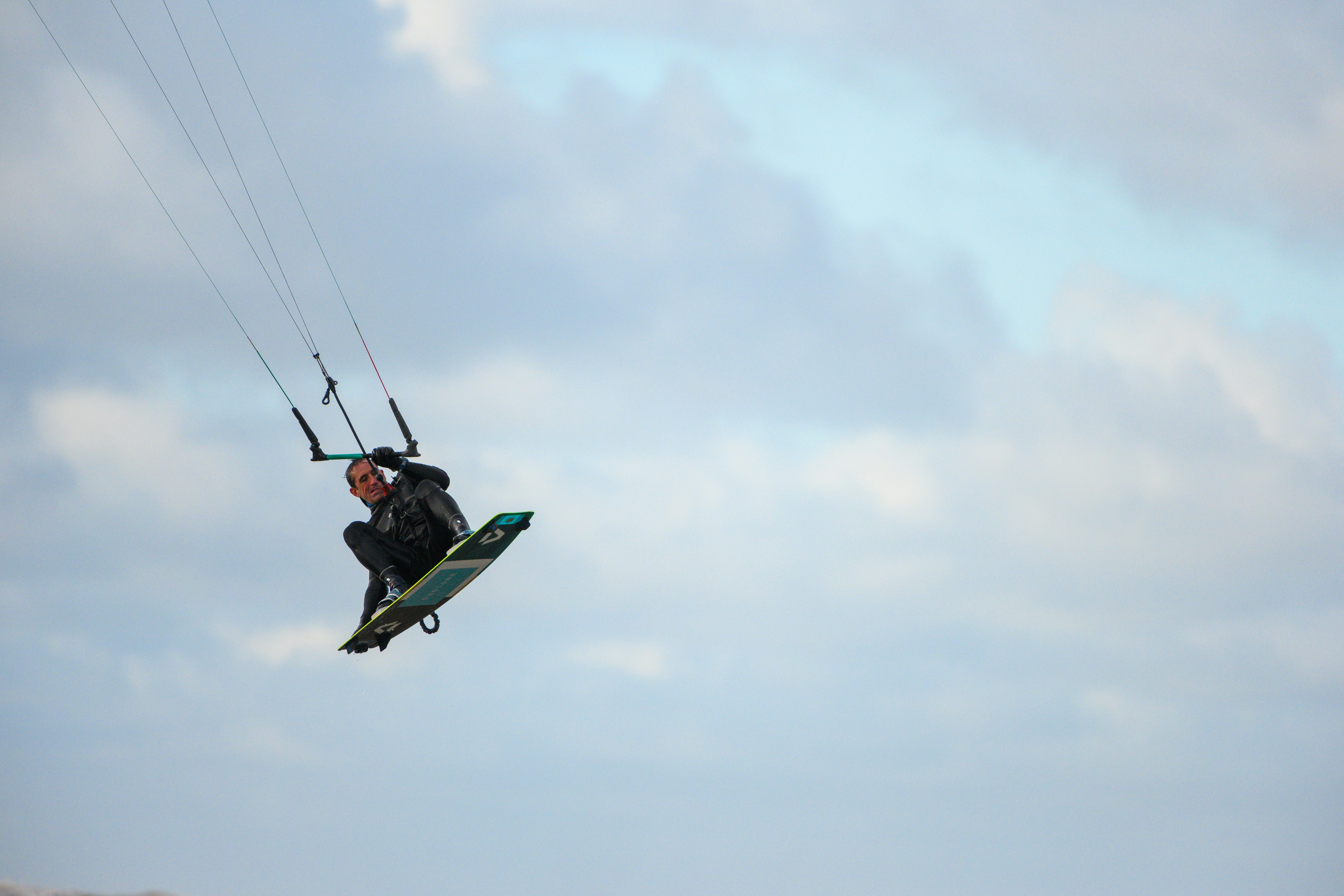 a man parasailing in the air