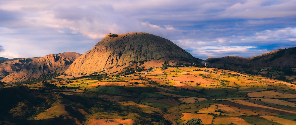 a mountain with a valley below