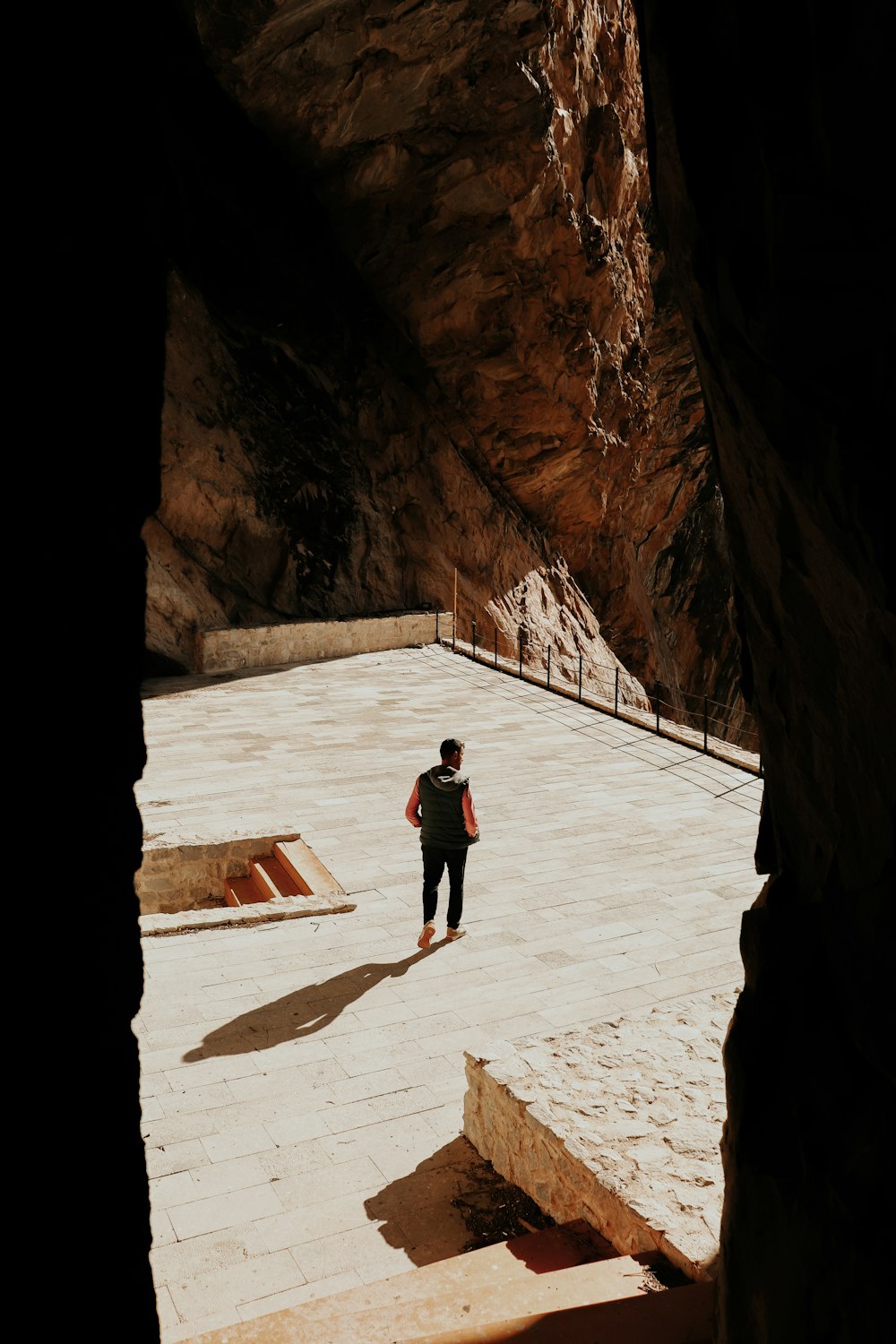 a person standing in a cave