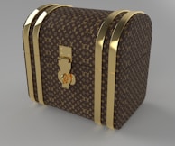 A luxury chest with a curved top, adorned with a recognizable brown and gold monogram pattern. The chest features gold-colored metal bands and a central lock, giving it an elegant and sophisticated look.