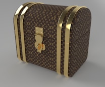 A luxury chest with a curved top, adorned with a recognizable brown and gold monogram pattern. The chest features gold-colored metal bands and a central lock, giving it an elegant and sophisticated look.